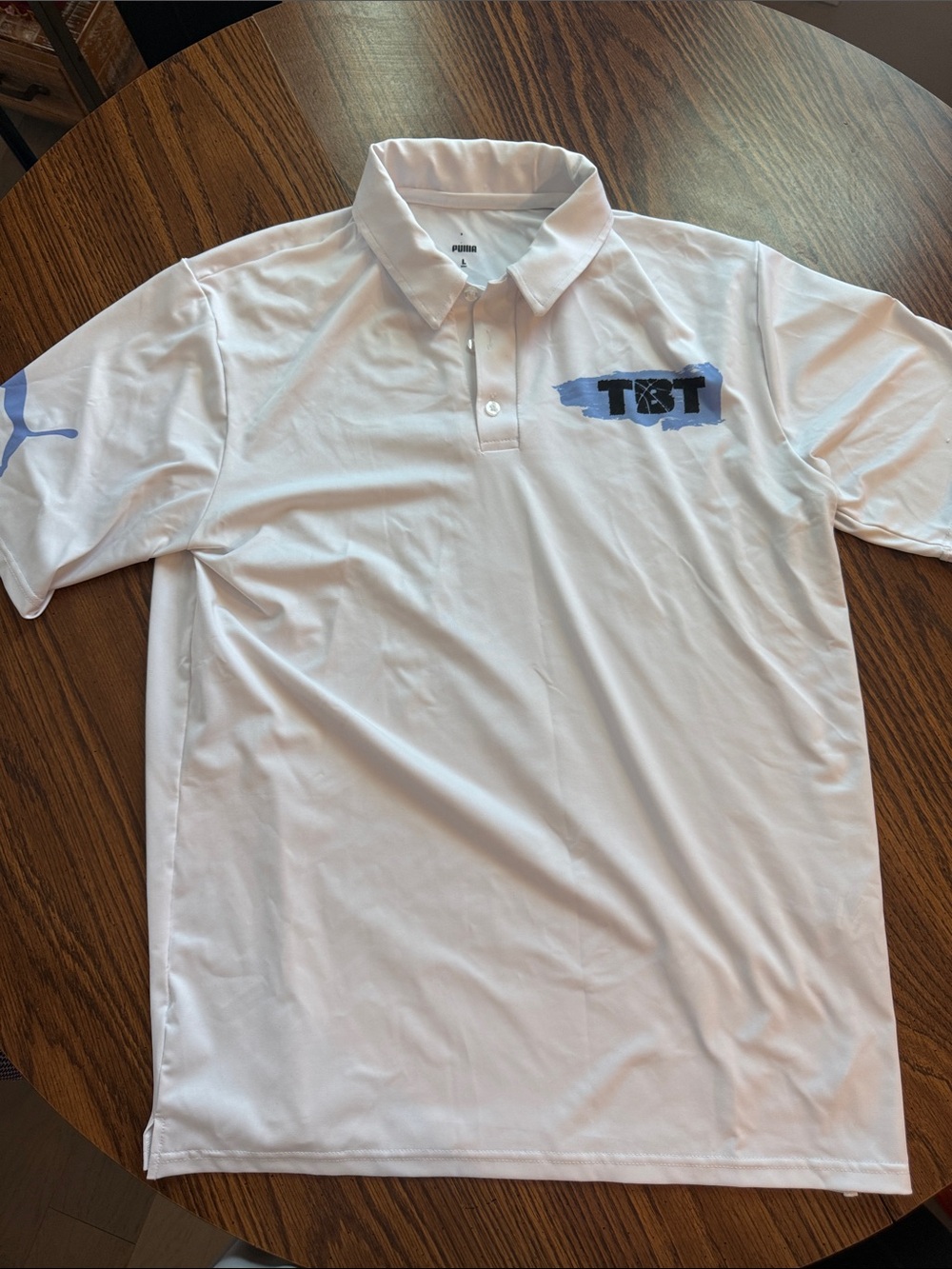 Puma White Polo with Light Blue TBT Accent